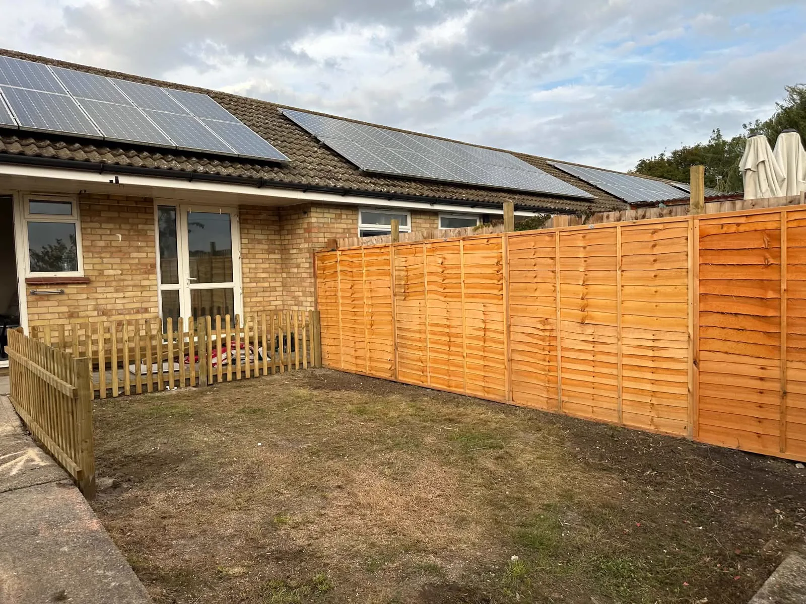 New fence panels along a garden